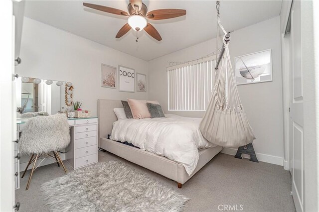 148 Mesquite Ct, Calimesa, CA 92320 - bedroom with baseboards, light colored carpet, and ceiling fan