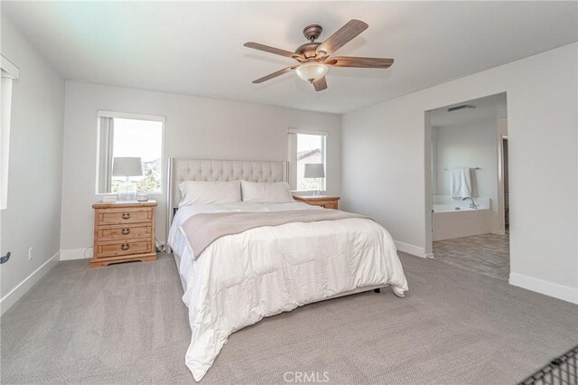 148 Mesquite Ct, Calimesa, CA 92320 - bedroom with baseboards, carpet floors, visible vents, a ceiling fan, and ensuite bathroom