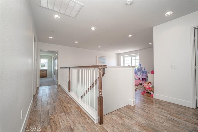 148 Mesquite Ct, Calimesa, CA 92320 - hallway featuring an upstairs landing, light wood-type flooring, and recessed lighting