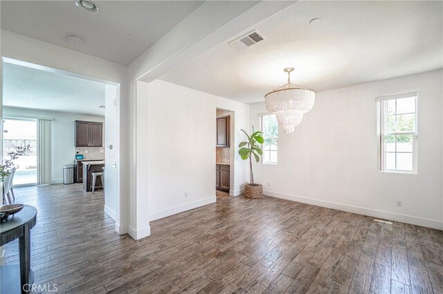 148 Mesquite Ct, Calimesa, CA 92320 - interior space with baseboards, visible vents, wood finished floors, and a chandelier