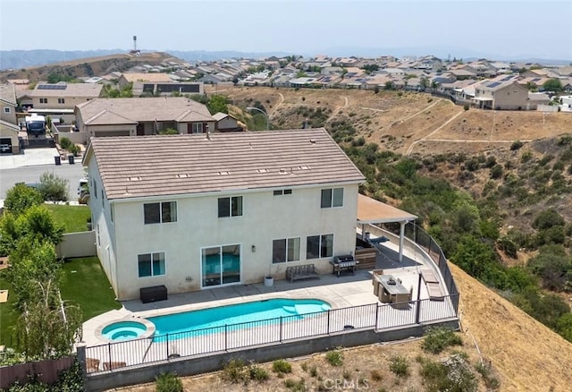 148 Mesquite Ct, Calimesa, CA 92320 - view of pool featuring a fenced backyard, a patio, a residential view, a pool with connected hot tub, and a grill
