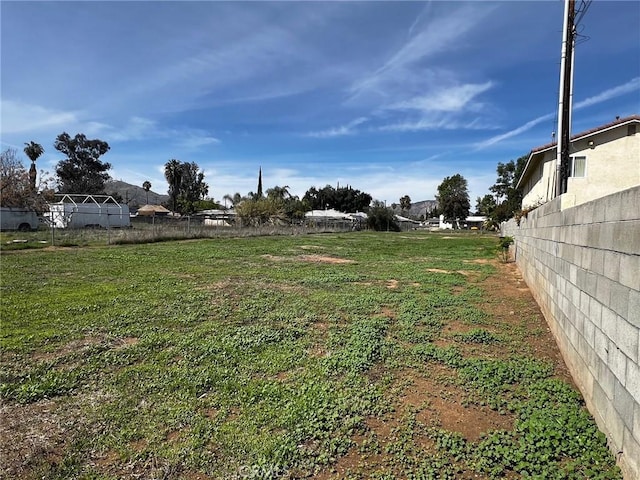 view of yard featuring fence