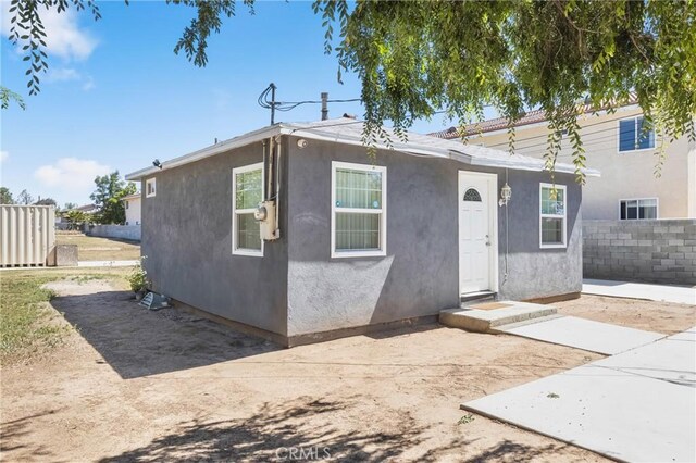 24412 Eucalyptus Ave, Moreno Valley, CA 92553 - view of front of property featuring stucco siding and a patio area