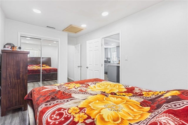 24412 Eucalyptus Ave, Moreno Valley, CA 92553 - bedroom featuring attic access, wood finished floors, a closet, and recessed lighting