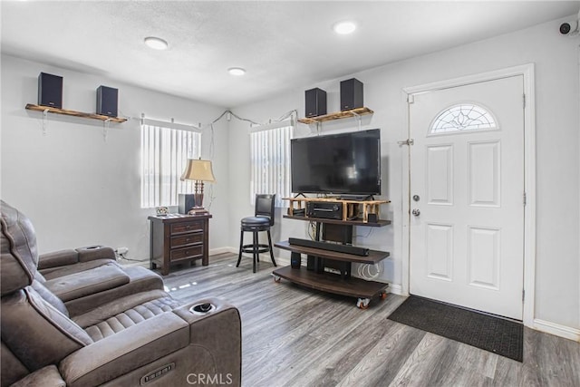 24412 Eucalyptus Ave, Moreno Valley, CA 92553 - living area with healthy amount of natural light, wood finished floors, baseboards, and recessed lighting