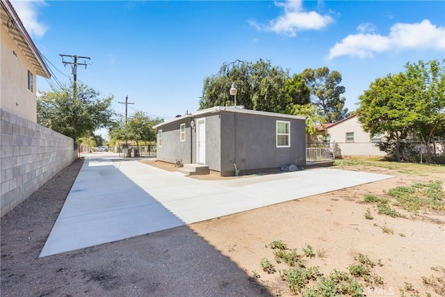 24412 Eucalyptus Ave, Moreno Valley, CA 92553 - back of property with stucco siding and a patio area