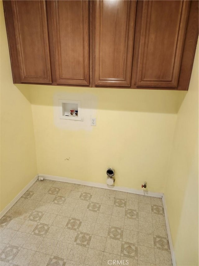 laundry room featuring baseboards, gas dryer hookup, cabinet space, hookup for a washing machine, and light floors