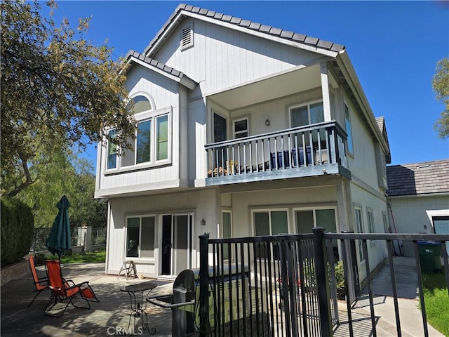 2 Wellesley Ct, Coto De Caza, CA 92679 - rear view of house with a balcony, fence, and a patio