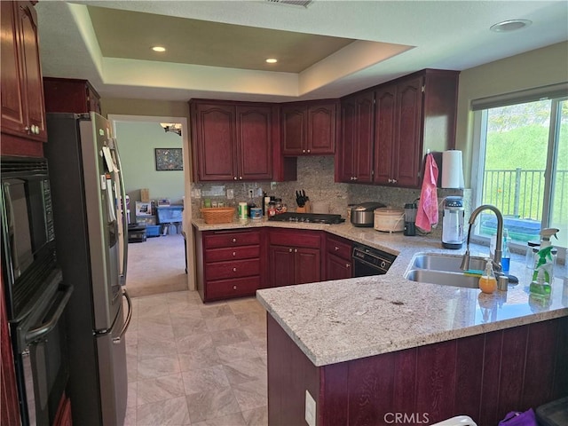 2 Wellesley Ct, Coto De Caza, CA 92679 - kitchen with black appliances, a sink, a raised ceiling, a peninsula, and recessed lighting