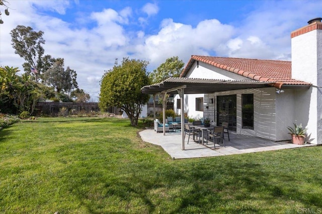 view of yard with a patio area, a pergola, and fence