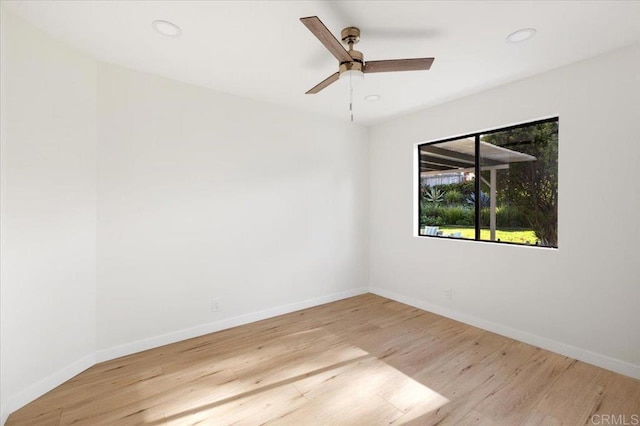 unfurnished room featuring recessed lighting, a ceiling fan, baseboards, and wood finished floors