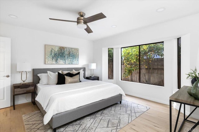 bedroom featuring a ceiling fan, recessed lighting, and wood finished floors