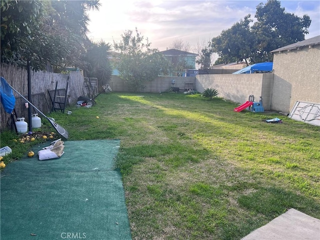 view of yard with a fenced backyard