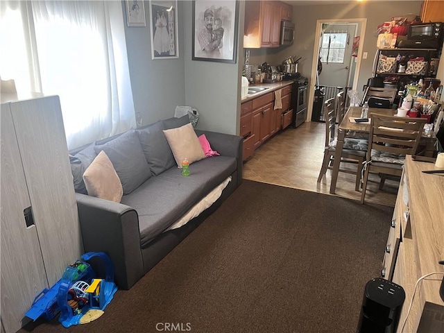 living area featuring light colored carpet