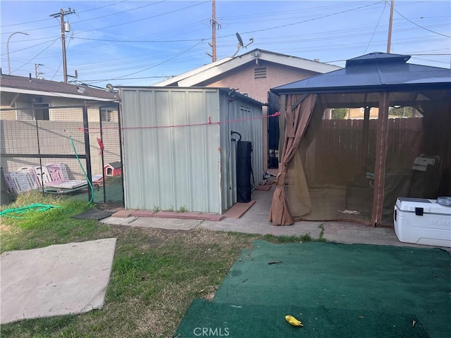 view of shed with a fenced backyard