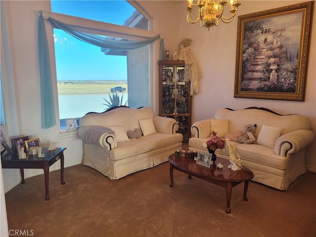 carpeted living area featuring a notable chandelier and baseboards