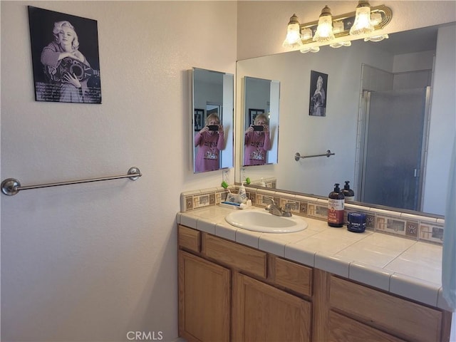 bathroom with vanity and walk in shower