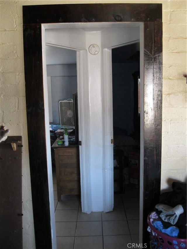 hallway with tile patterned floors