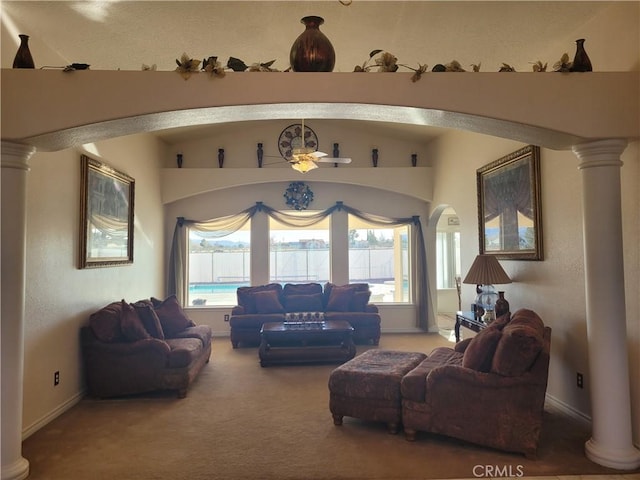 carpeted living area featuring vaulted ceiling and baseboards