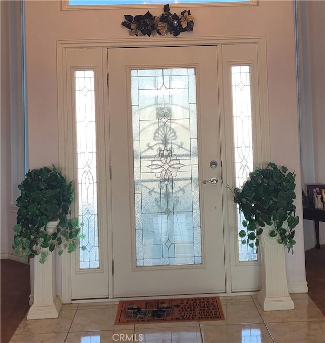 entryway featuring light tile patterned floors