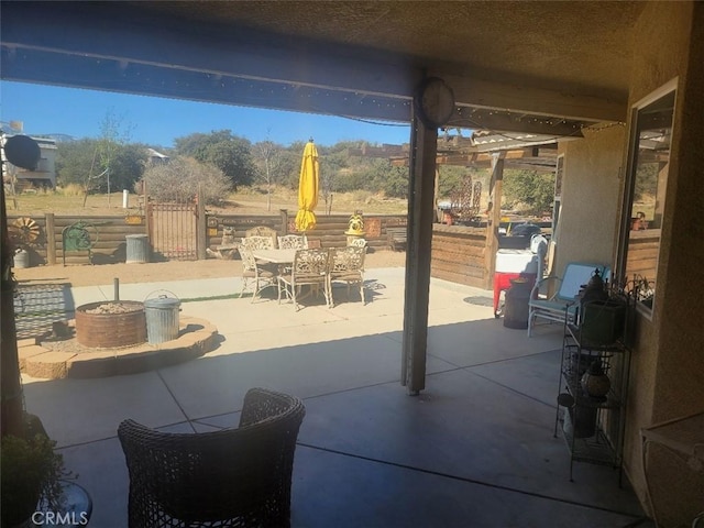 view of patio / terrace with outdoor dining space and fence
