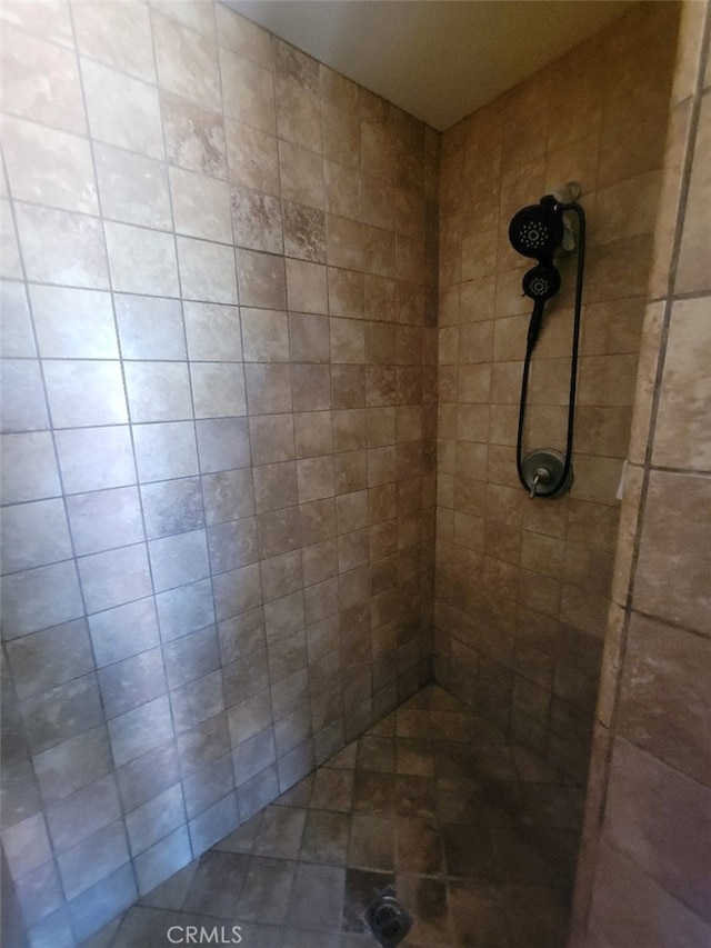 bathroom with tiled shower