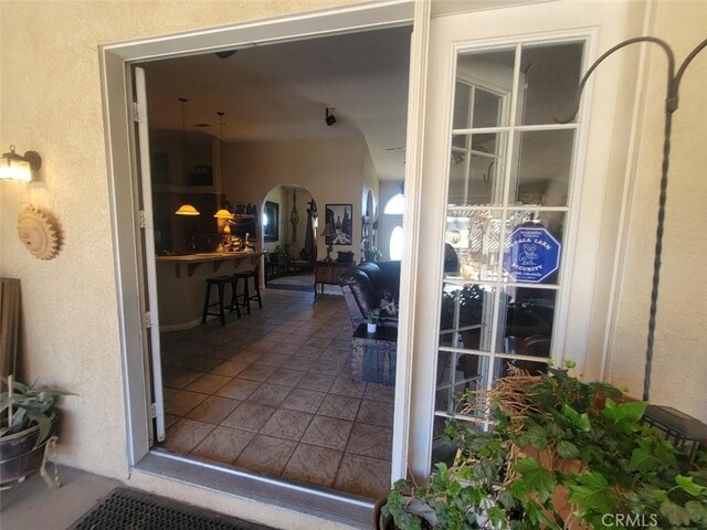 entrance to property with stucco siding
