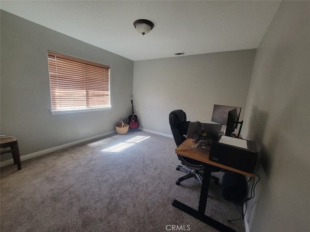 home office featuring carpet and baseboards