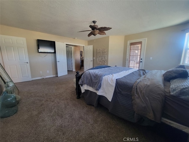 carpeted bedroom with multiple windows, a textured ceiling, baseboards, and ceiling fan