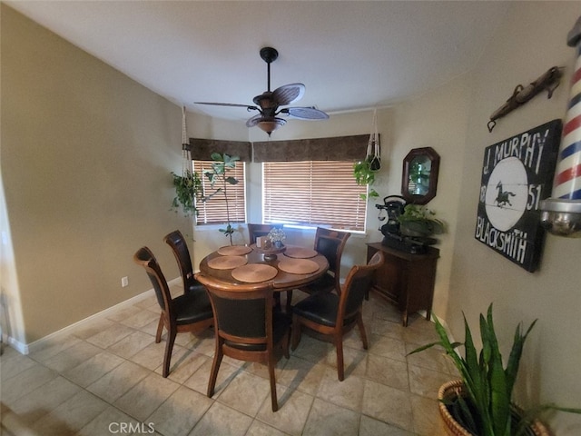 dining area featuring a ceiling fan and light tile patterned floors