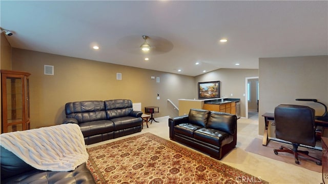 living area with vaulted ceiling, recessed lighting, visible vents, and light carpet