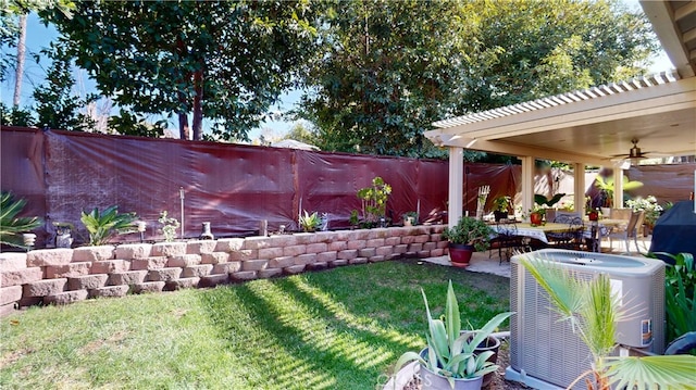 view of yard with a patio, cooling unit, a ceiling fan, a fenced backyard, and a pergola
