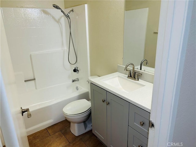 full bathroom with vanity, tile patterned floors, bathtub / shower combination, and toilet