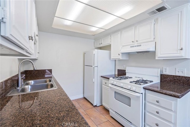 1251 S Meadow Ln Unit 145, Colton, CA 92324 - kitchen with white appliances, under cabinet range hood, a sink, and dark countertops