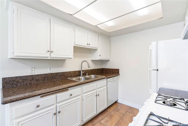 1251 S Meadow Ln Unit 145, Colton, CA 92324 - kitchen with a sink, white appliances, white cabinets, and baseboards