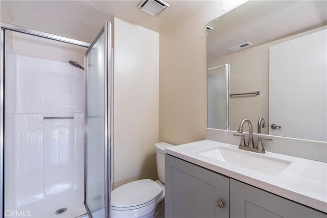 1251 S Meadow Ln Unit 145, Colton, CA 92324 - bathroom with a shower stall, toilet, and vanity