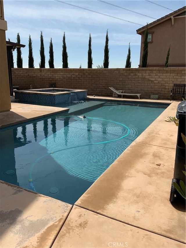 5230 Starling St, Fontana, CA 92336 - view of swimming pool with a patio, a fenced backyard, a fenced in pool, and an in ground hot tub