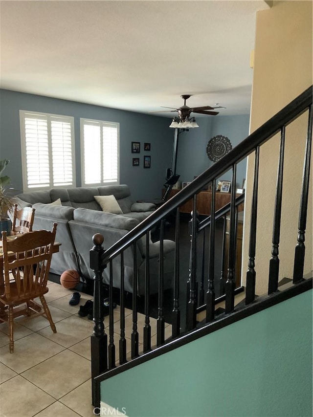 5230 Starling St, Fontana, CA 92336 - stairs featuring ceiling fan and tile patterned flooring