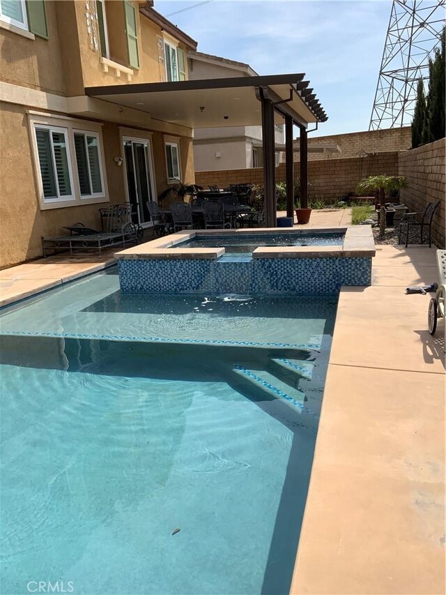 5230 Starling St, Fontana, CA 92336 - view of swimming pool featuring a fenced in pool, a patio area, an in ground hot tub, and a fenced backyard