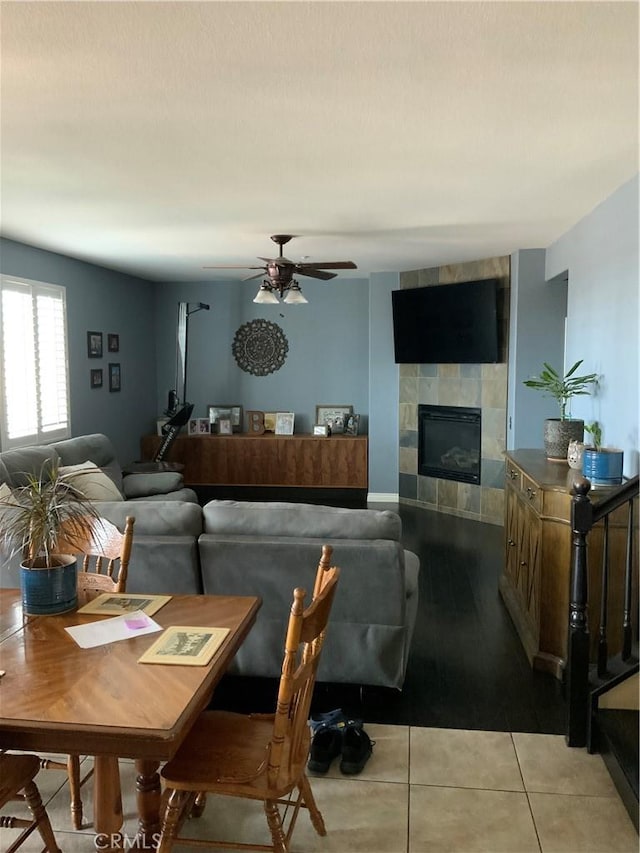 5230 Starling St, Fontana, CA 92336 - tiled living room with a tiled fireplace and ceiling fan
