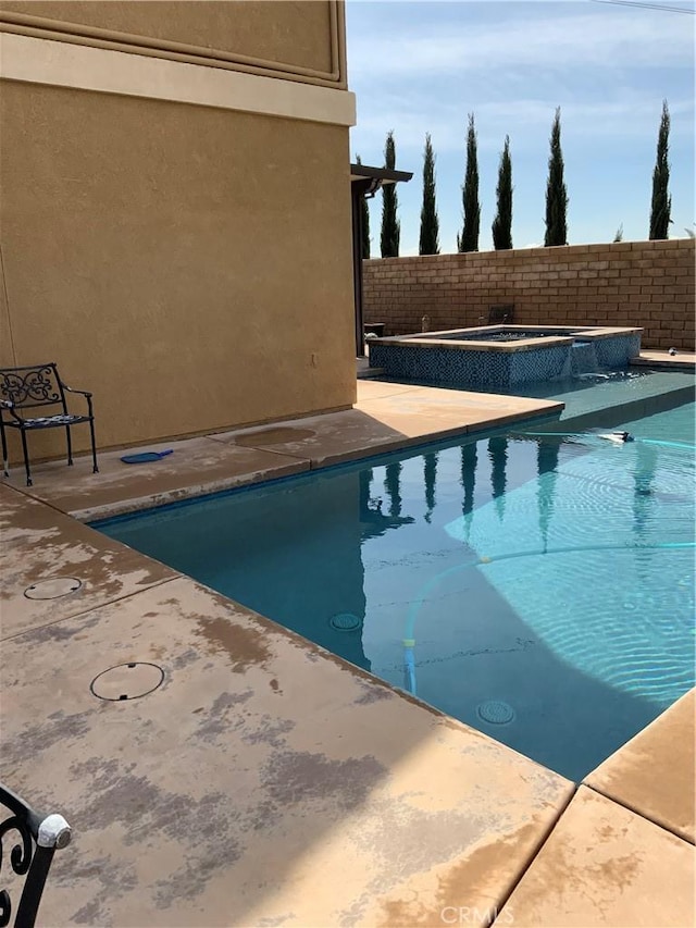 5230 Starling St, Fontana, CA 92336 - view of swimming pool featuring a fenced in pool, a patio, fence, and an in ground hot tub