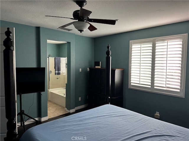 5230 Starling St, Fontana, CA 92336 - bedroom featuring ensuite bathroom, baseboards, ceiling fan, a textured ceiling, and tile patterned flooring