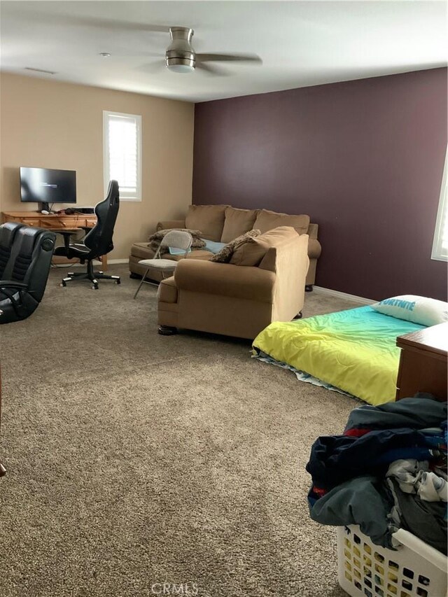 5230 Starling St, Fontana, CA 92336 - carpeted living room with baseboards and a ceiling fan