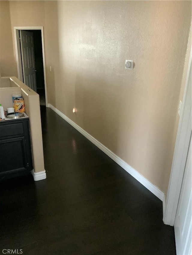 5230 Starling St, Fontana, CA 92336 - hall featuring dark wood-type flooring and baseboards
