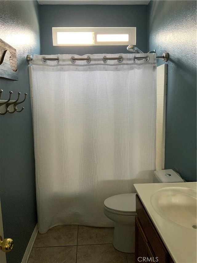 5230 Starling St, Fontana, CA 92336 - bathroom with tile patterned floors, vanity, and toilet