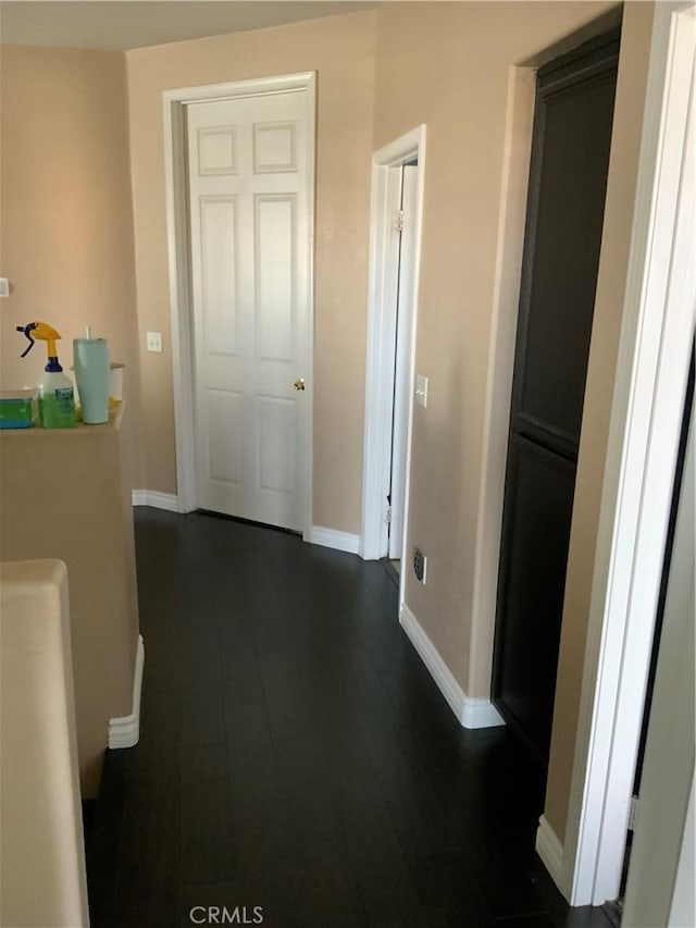 5230 Starling St, Fontana, CA 92336 - corridor featuring baseboards and dark wood-style floors