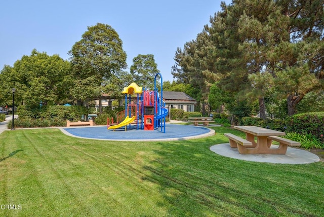 community playground featuring a lawn