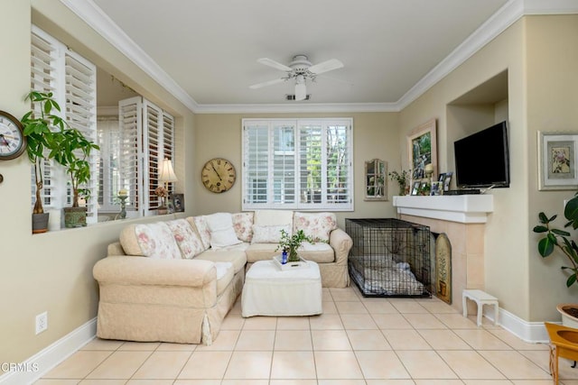 tiled living area featuring baseboards, crown molding, and ceiling fan