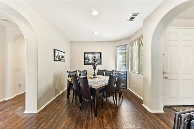 28183 Rocky Cove Dr, Menifee, CA 92585 - dining space with wood finished floors, recessed lighting, and arched walkways