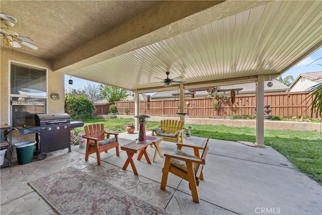 28183 Rocky Cove Dr, Menifee, CA 92585 - fenced backyard with a ceiling fan, a patio area, grilling area, and an outdoor living space